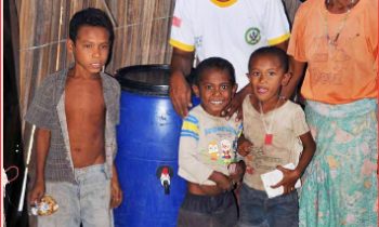 Apr 2023 GREEN TIMOR LESTE_Family w Water tank